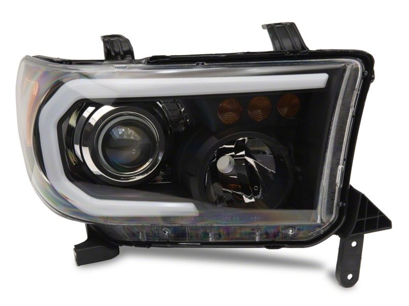 Raxiom 07-13 Toyota Tundra Axial Projector Headlights w/ SEQL LED Bar- Blk Housing (Clear Lens)