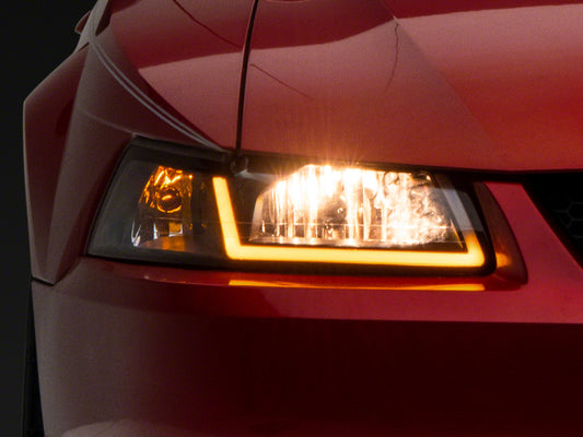 Raxiom 99-04 Ford Mustang Axial Series Headlights w/ Sequential LED Bar- Blk Housing (Clear Lens)
