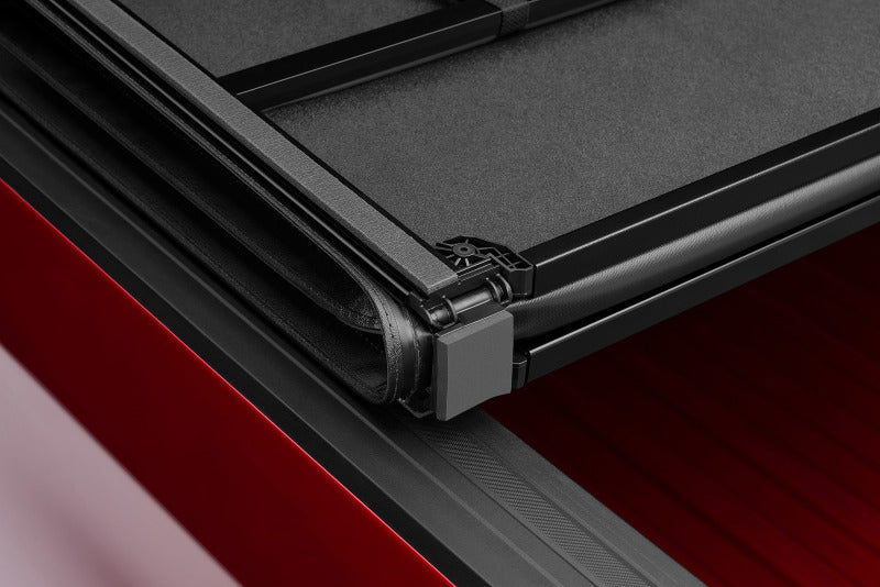 Lund 05-17 Nissan Frontier Styleside (5ft. Bed) Hard Fold Tonneau Cover - Black