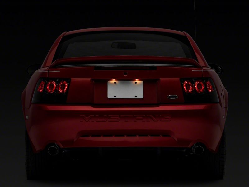 Raxiom 99-04 Ford Mustang Axial Series Altezza Style Tail Lights- Blk Housing (Smoked Lens)