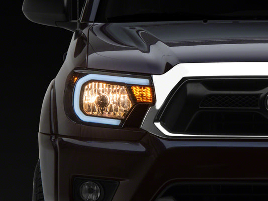 Raxiom 12-15 Toyota Tacoma Axial Series Headlights w/ LED Bar- Blk Housing (Clear Lens)