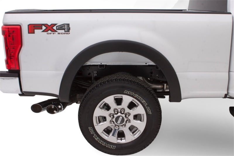 Bushwacker 16-18 Nissan Titan XD Pocket Style Flares 4pc 78.0in Bed - Black